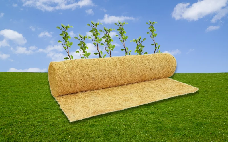 roll of excelsior mat on grass and blue sky landscape