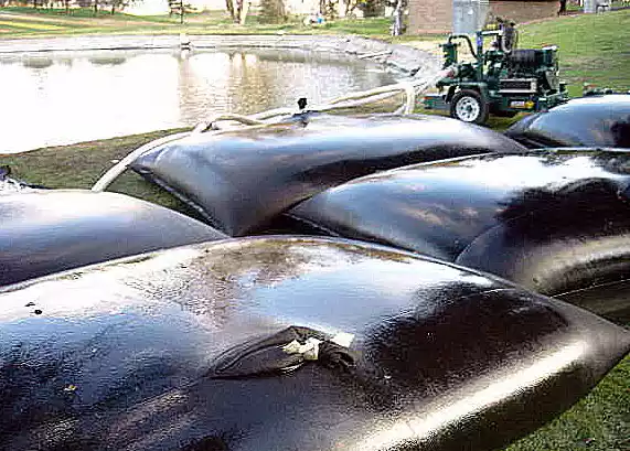 Lauhjong, Munshigonj, Bangladesh. 10th Oct, 2023. Geo bags are lined up on  the river bank to be thrown into the water. These bags are used to prevent  temporary erosion. Due to continuous