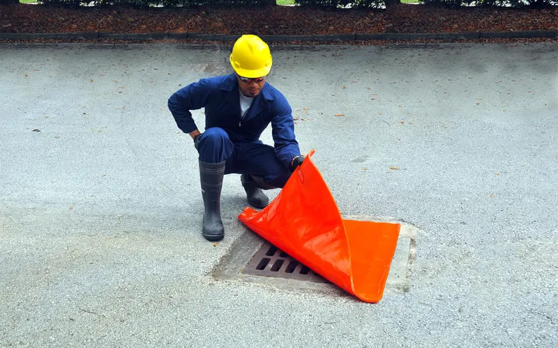 orage and yellow storm drain covers